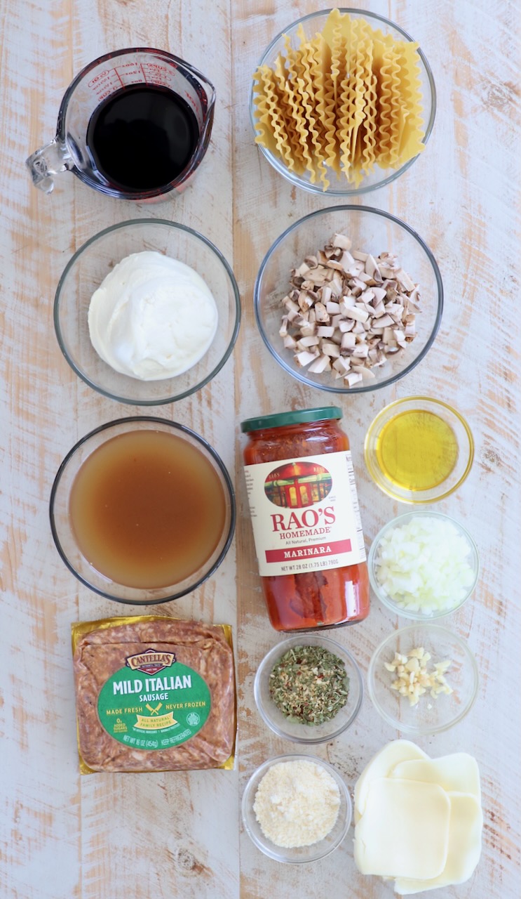 ingredients for skillet lasagna on white wood background