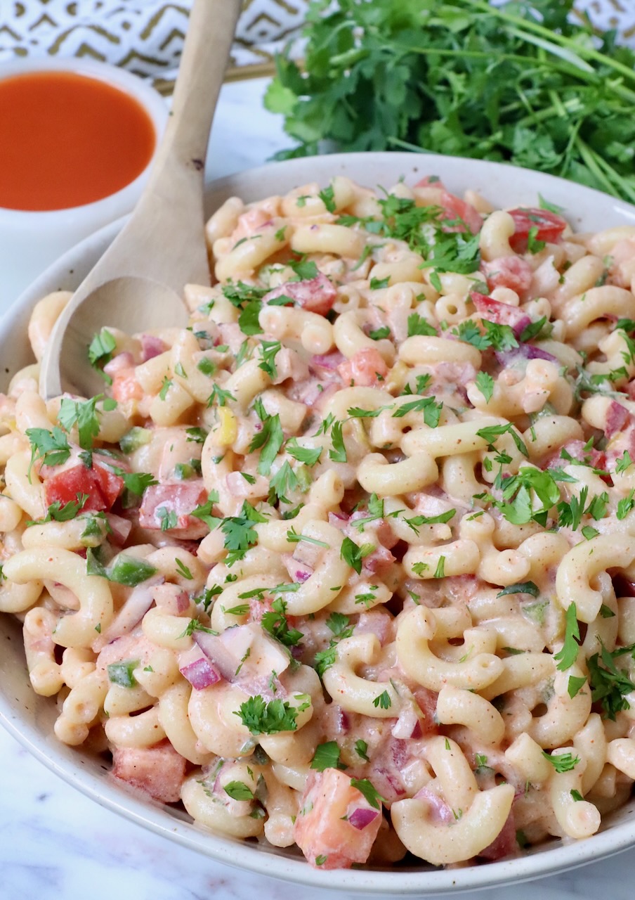macaroni salad in bowl with spoon