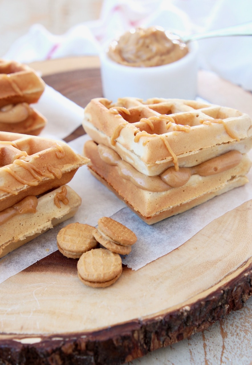 Peanut Butter Waffles with Creamy Peanut Butter filling and Mini Nutter Butter Cookies on Wood Cutting Board