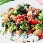 Teriyaki chicken and broccoli over rice on plate