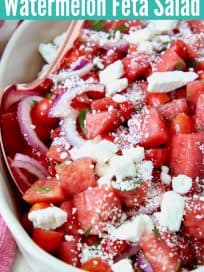 Diced watermelon in bowl with crumbled feta cheese