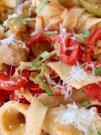 Italian drunken noodles in bowl with fork