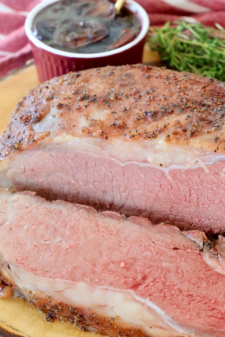 smoked strip roast, sliced on wood serving tray