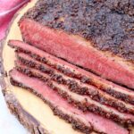 smoked pastrami sliced on wood board