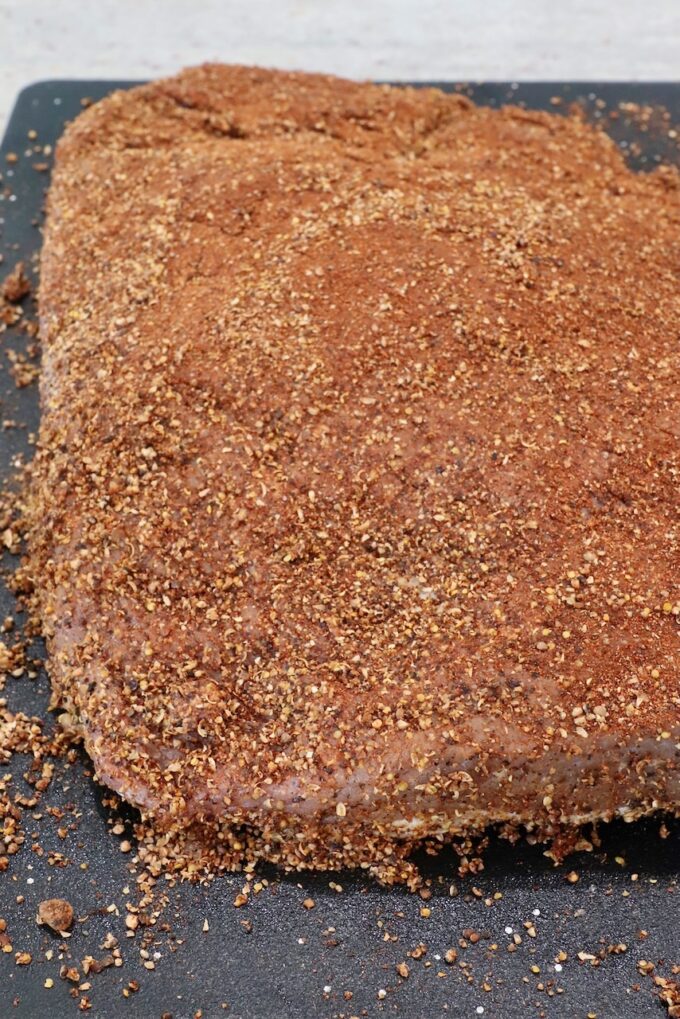 seasoned brisket on cutting board